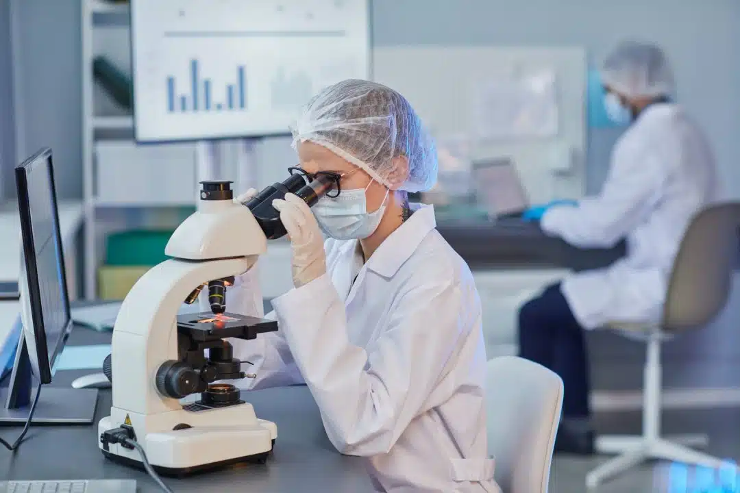 woman holding research at the laboratory - BIORLAB